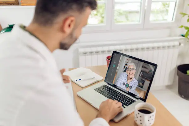 A person having a secure telepsychiatry session on a laptop